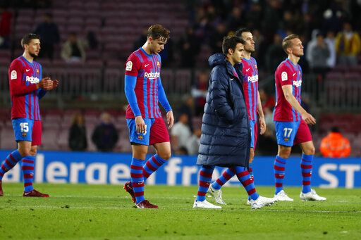 ar-304249918 Barcelona's team players walk after the Spanish La Liga soccer match between FC Barcelona and Rayo Vallecano at the Camp Nou stadium in Barcelona, Spain, Sunday, April 24, 2022.