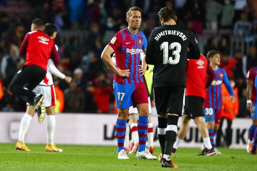 ep-304249918-1 Barcelona's Luuk de Jong, centre, reacts after the Spanish La Liga soccer match between FC Barcelona and Rayo Vallecano at the Camp Nou stadium in Barcelona, Spain, Sunday, April 24, 2022.