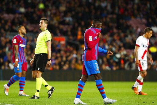 ep-304249918-8 Barcelona's Ousmane Dembele, centre, reacts after the Spanish La Liga soccer match between FC Barcelona and Rayo Vallecano at the Camp Nou stadium in Barcelona, Spain, Sunday, April 24, 2022.