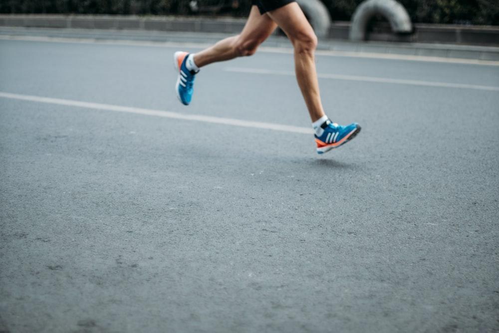 image2 pair of blue-and-white Adidas running shoes