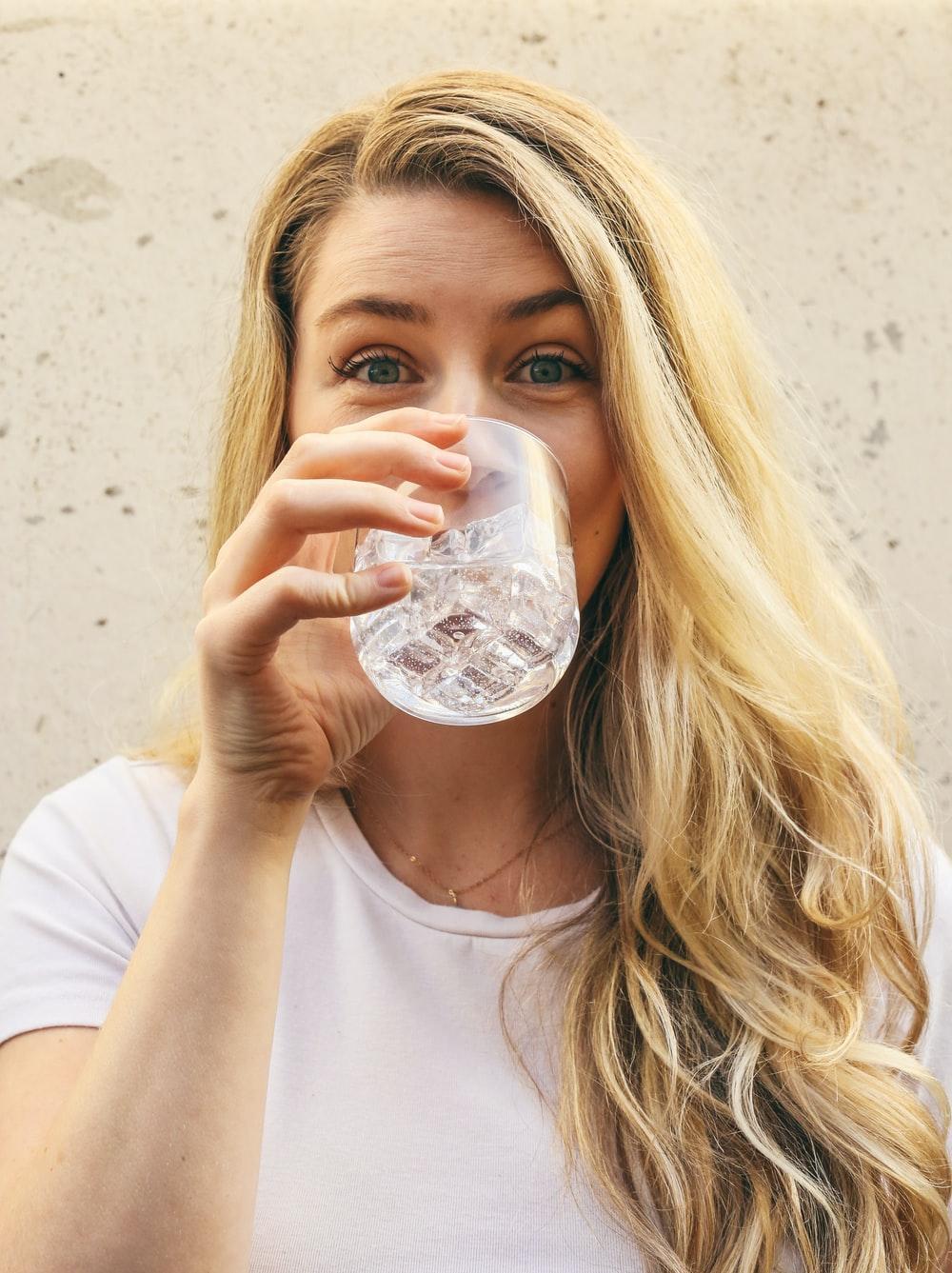 image3-1 woman in white crew neck shirt drinking water
